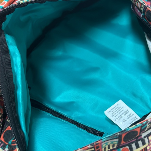 Kavu sling bag backpack in geometric print of Spring Montage.  Good condition. main image 7